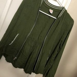 A girls varsity style zip up